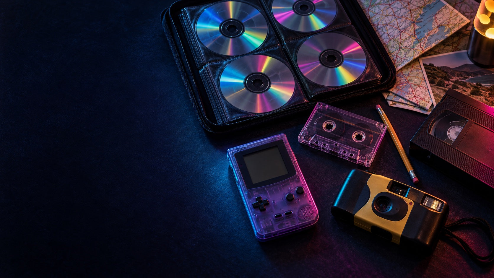 A CD binder, cassette tape, handheld game, paper map, VHS tape, and camera